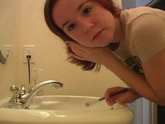 KiloPantyhose presents: Redhead in tee shirt does her makeup