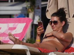 KiloPantyhose presents: Topless amateur relaxes on a lounge chair